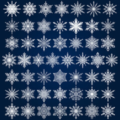 A set of fifty white snowflakes on a blue background. Vector set of winter icons. Element of decoration.