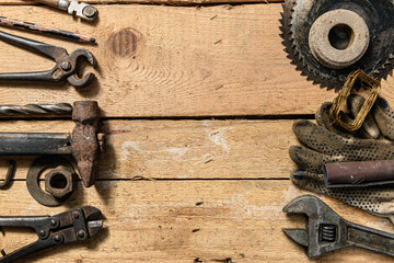 Old vintage household hand tools still life on a wooden background with frame, copyspace and place for text