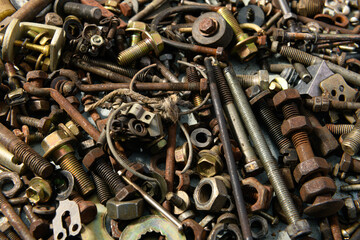 background from old vintage hand tools - set of different screws and nuts