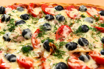 homemade pizza, vegetarian food, baked vegetables and cheese, tomatoes and olives, delicious food on a wooden background