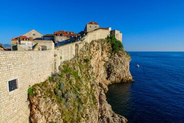 Fototapeta na wymiar Walls of Dubrovnik surrounding the old city of Dubrovnik in Croatia