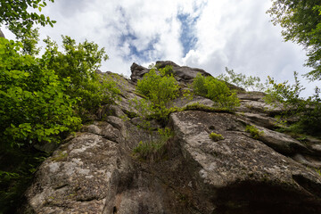 Beautiful rocks against the blue sky. Bottom view.Nature. The mountains. T