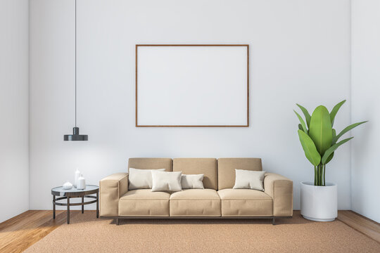 Hall with frame blank canvas and brown sofa against white wall