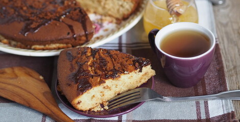 Festive homemade cakes. Round chocolate muffin, large cupcake or chocolate cake on a wooden ancient background.