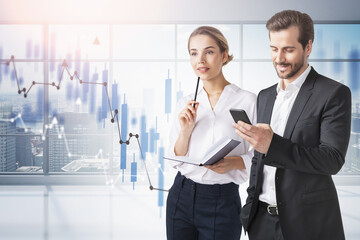 Man and woman in office and graph