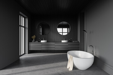 Tub and sink in gray and wooden bathroom