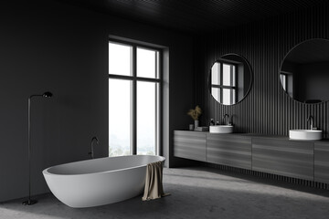 Dark wooden bathroom corner with double sink and tub