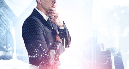 Pensive businessman in city and chart