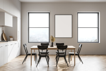 White kitchen interior with table and poster