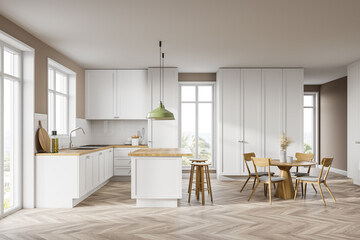 White kitchen interior with bar and table