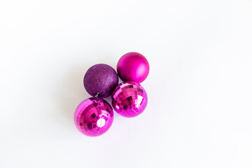 Christmas tree jewelry. purple balls on a blank background