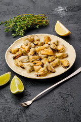 Peeled mussels on ceramic plate