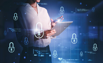 Woman with tablet in office, cyber security