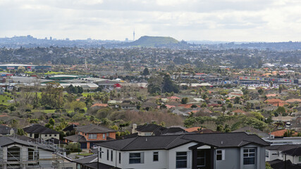 AUCKLAND, NEW ZEALAND - Aug 31, 2019: East Tamaki Heights suburban houses with hills on the horizon