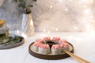 Sushi roll with pink cream, salmon