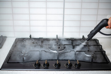 steam disinfection and sanitization of the house, steam treatment of the kitchen gas stove