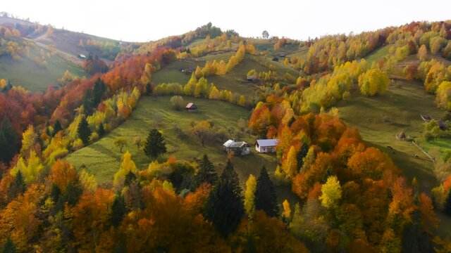 Aerial drone footage over Transylvanian village in Romanian Carpathian mountains , Romania landscape