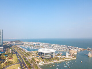 Fototapeta premium Aerial view of the Yacht Terminal, Xiamen Xiangshan Yacht Club in Xiamen city. Xiamen city architecture on the coastline in Fujian, China