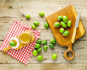 Still life with feijoa fruits and feijoa jam in the jar