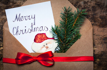 Merry Christmas card in a decorated envelope