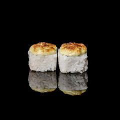 sushi on a black plate