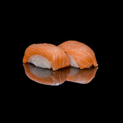 sushi on a black plate