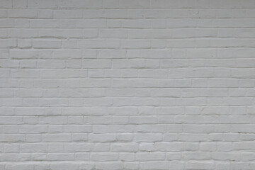 Old brick wall painted white photographed horizontally