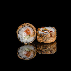 sushi on a black plate