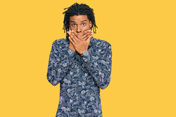 Young african american man wearing 80s shirt shocked covering mouth with hands for mistake. secret concept.