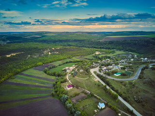 Little moldavian village Goeni in green lands, aerial view, summer time, Moldova republic of.