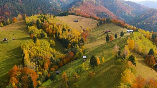Aerial drone footage over Transylvanian village in Romanian Carpathian mountains , Romania landscape
