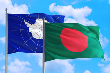 Bangladesh and Antarctica national flag waving in the windy deep blue sky. Diplomacy and international relations concept.
