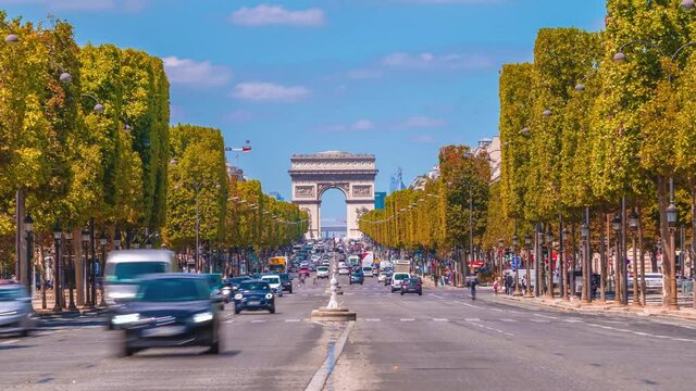 4k timelapse of Paris cityscape, Arch De Triumph (Arch De Triomphe) on Champs Elysees in Paris and the traffic,the most famous landmark in Paris,France.Sunny day in autumn with golden yellow leaves