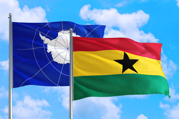 Ghana and Antarctica national flag waving in the windy deep blue sky. Diplomacy and international relations concept.