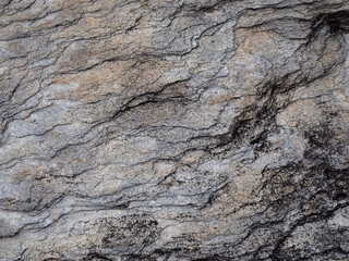 Closeup of rock surface with wave pattern