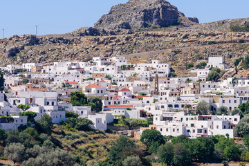 Sightseeing of Greece. Lindos village is a traditional village with colorful white buildings,...