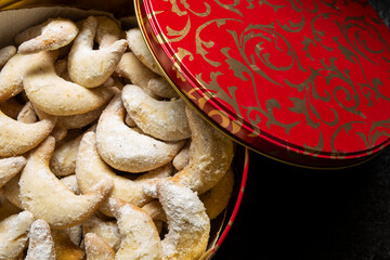 moon shaped cookies in red and gold cookie jar