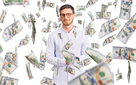 Handsome young man with bear wearing elegant business shirt and glasses with hands together and crossed fingers smiling relaxed and cheerful. success and optimistic