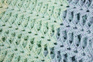 handmade multicolor crochet background in green and blue with double crochet stitches - 390995607