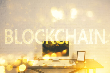 Double exposure of blockchain theme hologram and table with computer background. Concept of bitcoin...