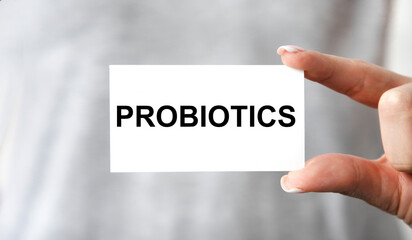 Doctor advises. Medical worker holds PROBIOTICS sign, healthy lifestyle concept.