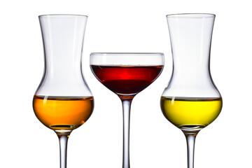 Glasses of different alcoholic drinks isolated on a white background