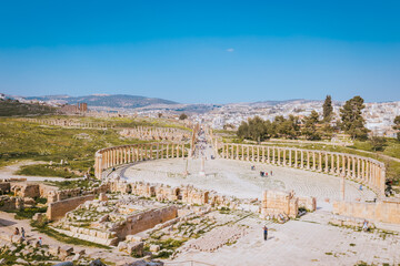 The oval forum of the Jerash archaeological site with the new part of the city in the background