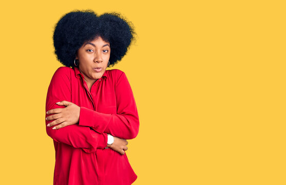 Young african american girl wearing casual clothes shaking and freezing for winter cold with sad and shock expression on face