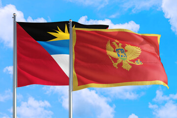 Fototapeta na wymiar Montenegro and Antigua and Barbuda national flag waving in the windy deep blue sky. Diplomacy and international relations concept.