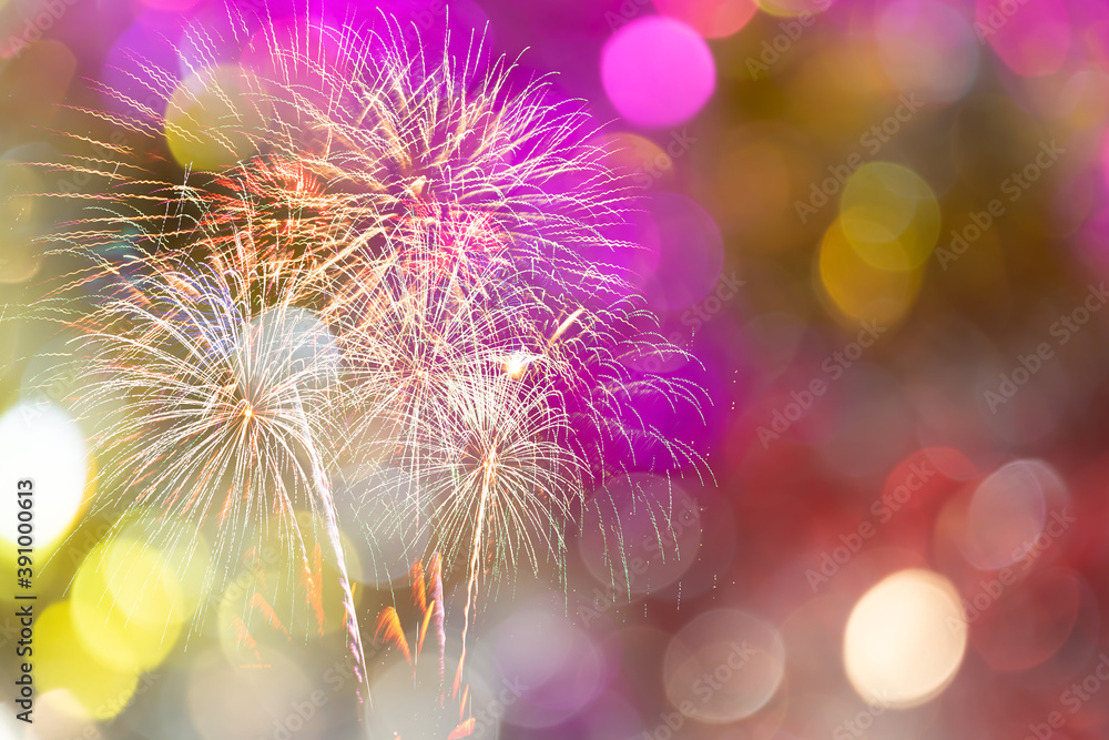 Wall mural colorful of fireworks display on bokeh light in pastel colored for background.