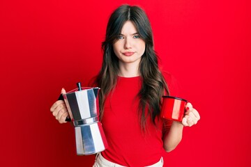 Young beautiful caucasian girl drinking italian coffee skeptic and nervous, frowning upset because of problem. negative person.