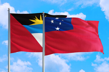Samoa and Antigua and Barbuda national flag waving in the windy deep blue sky. Diplomacy and international relations concept.