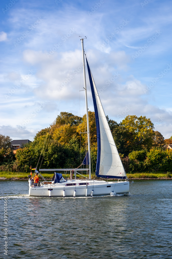 Sticker rendsburg, germany - oct 19, 2020: sailing ships at the kiel canal in germany on a sunny day.