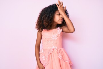 African american child with curly hair wearing princess crown surprised with hand on head for mistake, remember error. forgot, bad memory concept. © Krakenimages.com
